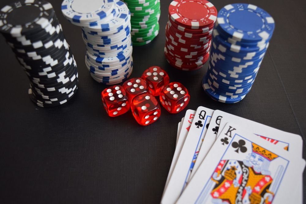 Casino chips, dice and cards, illustrating whether casino winnings are taxed in Canada