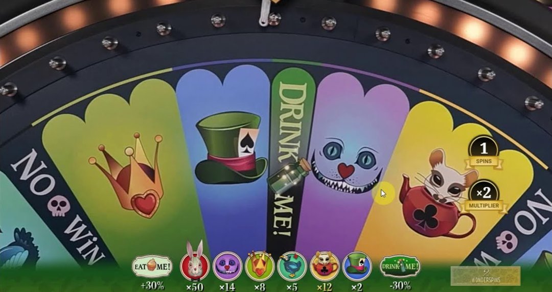 The adventures beyond wonderland live WonderSpins wheel with Queen, Mad Hatter, Cheshire Cat and Dormouse segments, Drink Me and No Win slots and the character multiplier row