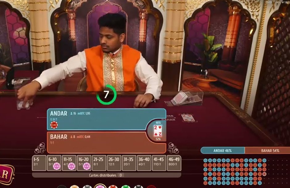 An andar bahar live table in play with the Andar 0.9:1 and Bahar 1:1 bet spots, the Joker card and the card count side bets from 1-5 to 46-49