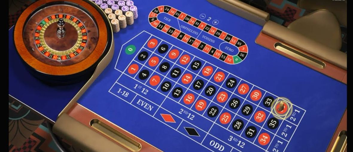 An auto roulette live table with the automated wheel, the racetrack for French bets and the full number layout