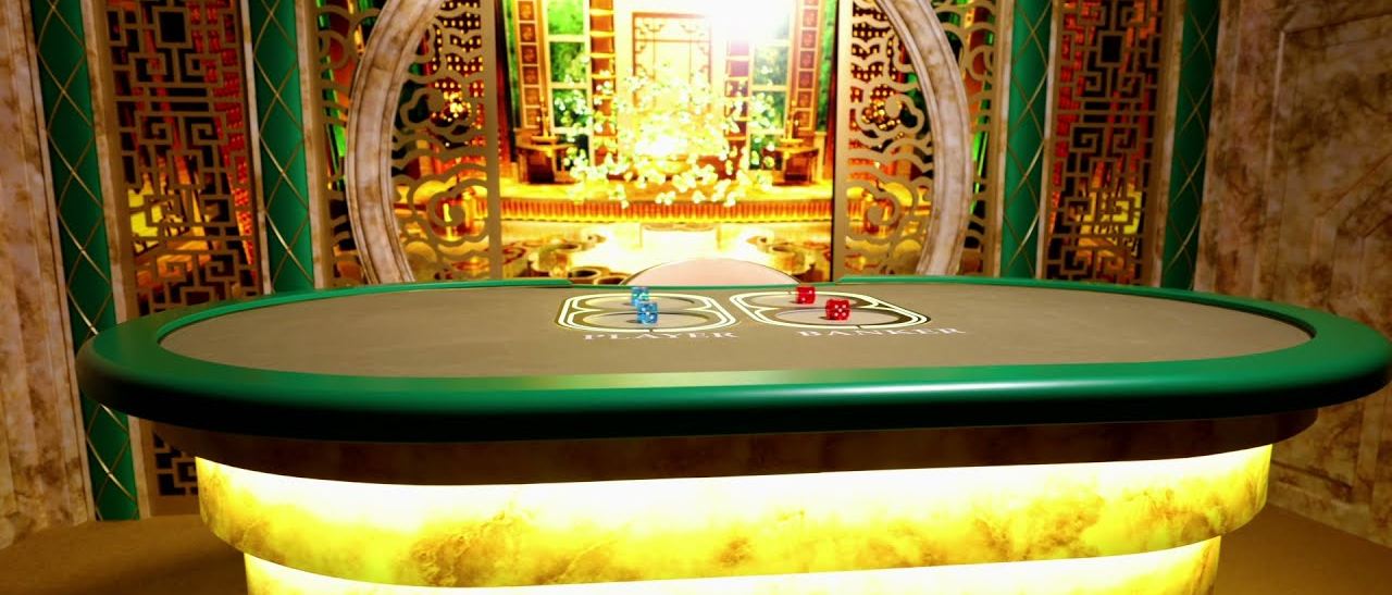 The bac bo live table with blue Player dice and red Banker dice in their shaker wells in an Asian themed studio