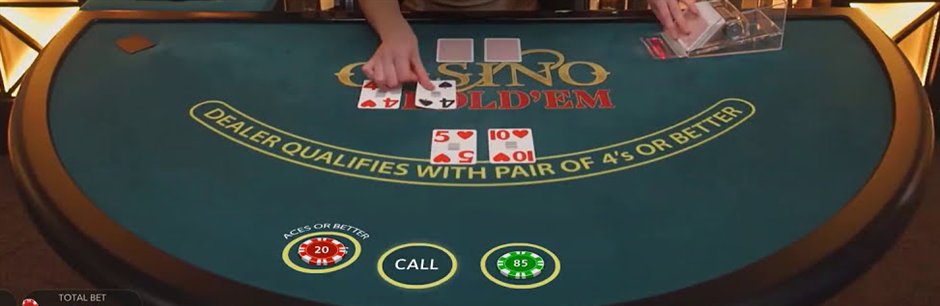 A live casino holdem felt printed with dealer qualifies with pair of 4s or better above the Ante and Call circles