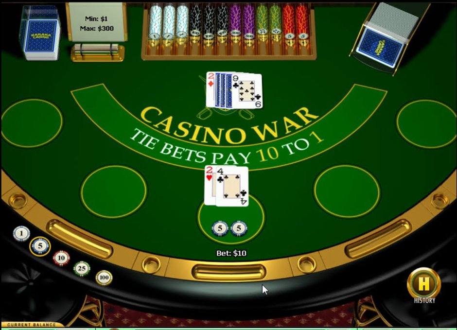 A casino war table printed with tie bets pay 10 to 1 above the betting circles with cards dealt to the player and dealer