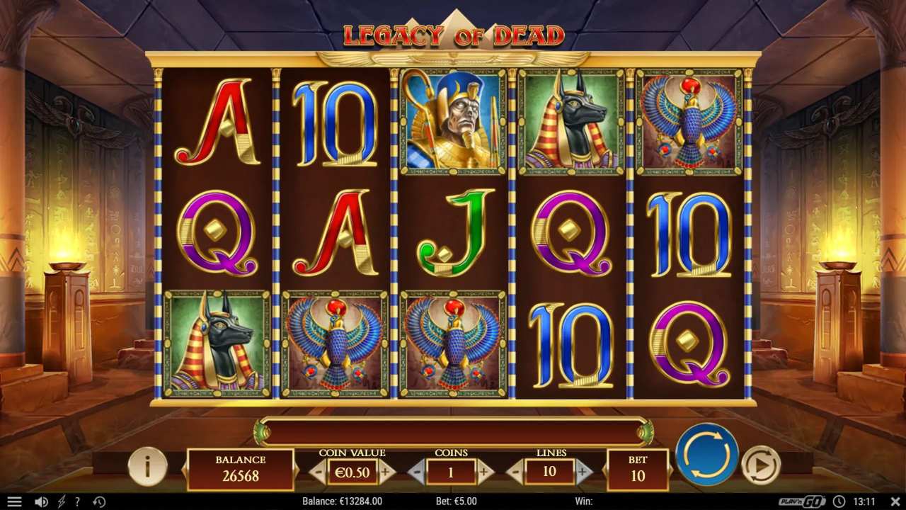 An Egyptian slot reel set showing jackal headed and falcon symbols beside gold card royals inside a temple