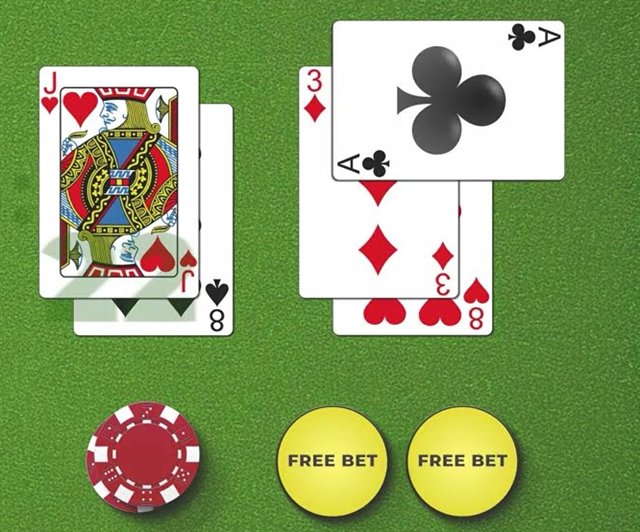 Free bet blackjack hands on green felt with a real chip beside two yellow free bet markers for a split and a double
