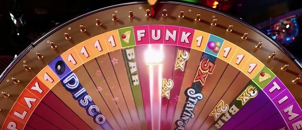 The funky time live DigiWheel with PLAY, FUNK and TIME letters, number 1 segments, Bar, Disco and Stayin Alive bonuses and 2x and 5x multipliers