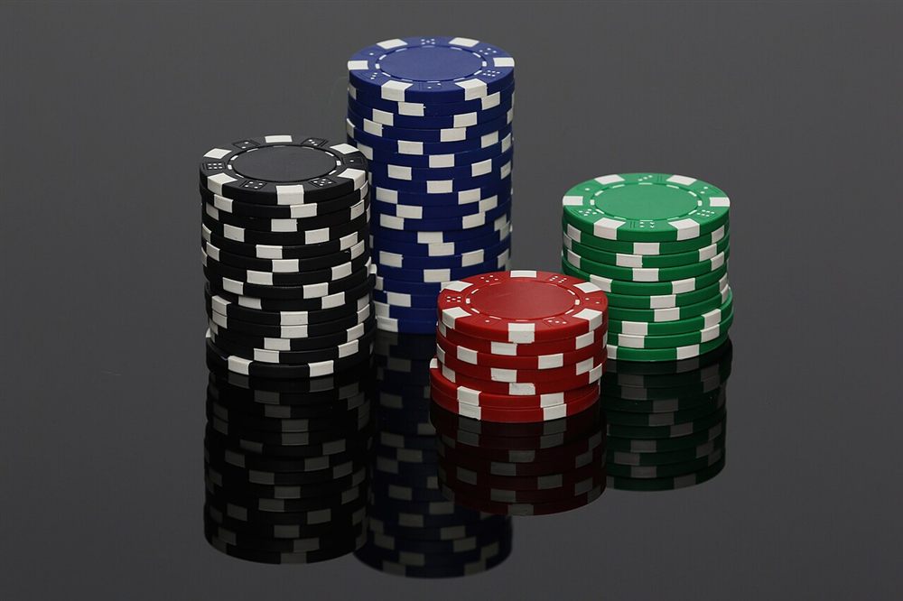 High roller casino bonus stakes shown as stacked casino chips