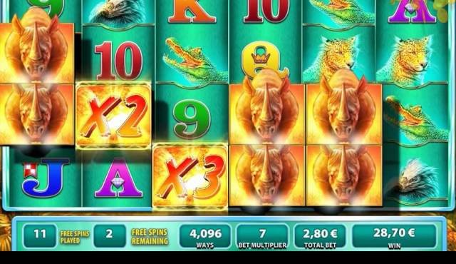 A Raging Rhino free spins screen with rhino symbols, x2 and x3 multipliers and a 4,096 ways counter