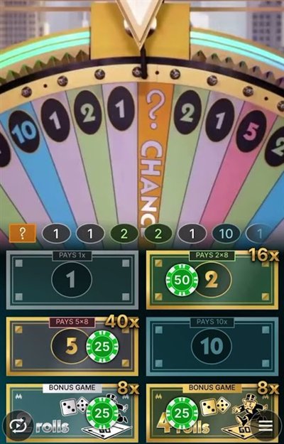 The monopoly live money wheel with a CHANCE segment under the flapper above the 1, 2, 5, 10, 2 Rolls and 4 Rolls bet spots