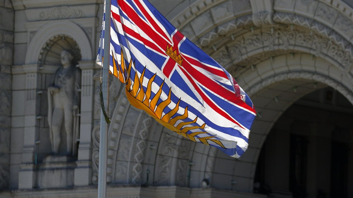 The British Columbia flag at the provincial legislature, where the rules governing online casinos here are set