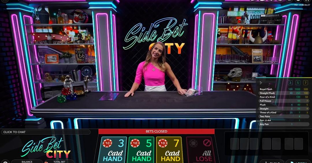 The side bet city live table with the paytable for the 3, 5 and 7 card hands and the 3 Card, 5 Card, 7 Card and All Lose bet spots