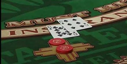 A super fun 21 felt with a ten and a five dealt above two red chips on the betting spot