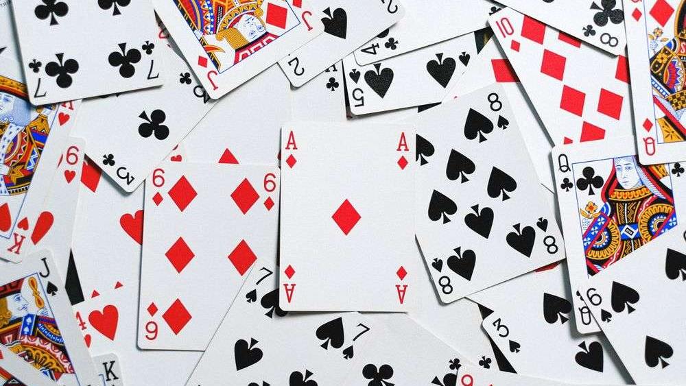 Playing cards spread across a table, the cards a baccarat card counting Canada player tracks