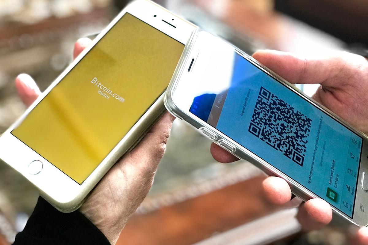Two phones with Bitcoin Cash wallets, one showing a BCH receive QR code for a Bitcoin Cash casino Canada deposit