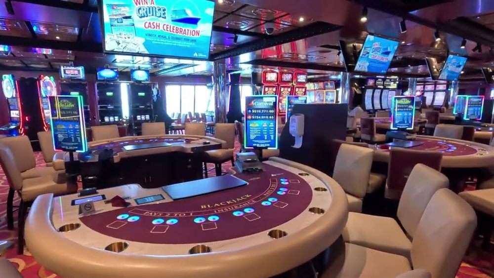 Blackjack tables and slot machines in a cruise ship casino, the setting of casino cruise ships Canada travellers board