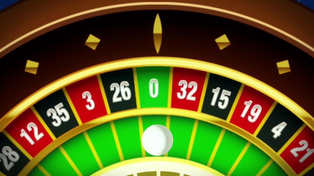 Roulette ball resting in the green zero pocket of a European wheel