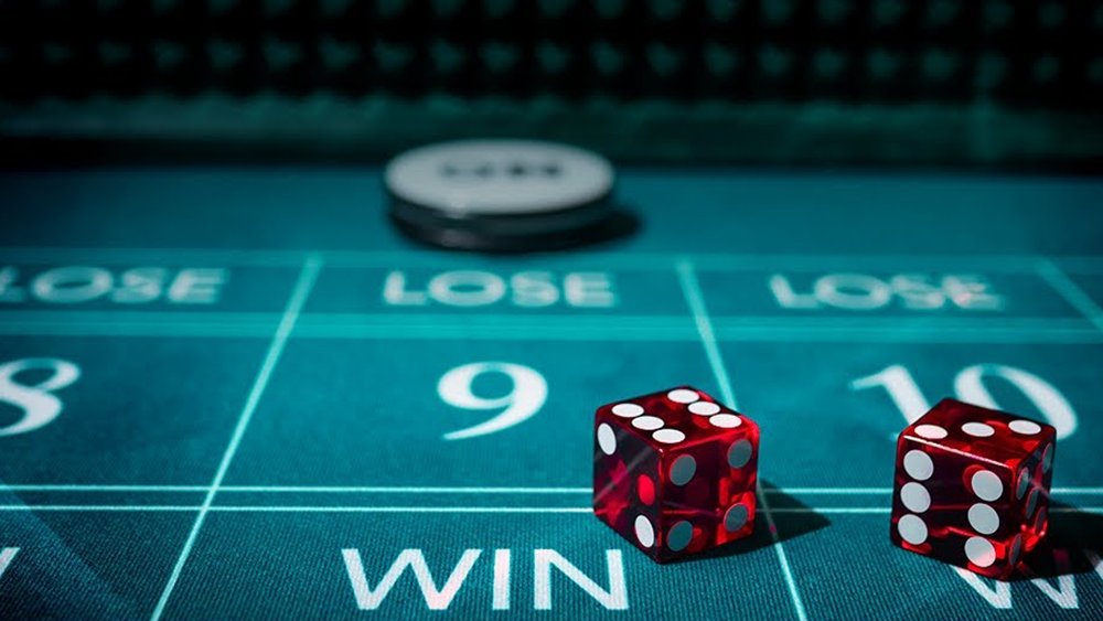 Free craps Canada: red dice on a craps layout from Evolution's Craps teaser