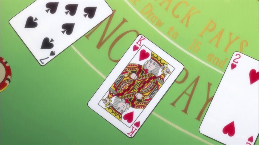 Playing cards and a chip on a green blackjack table in the Kaiji anime trailer