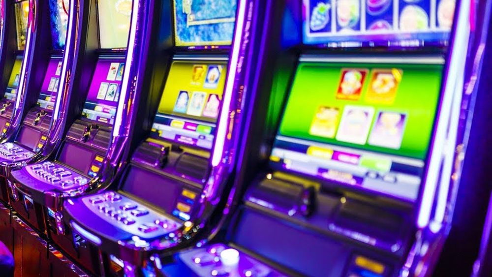 A row of lit slot machines from The Fifth Estate film Gambling on Addiction, one of the gambling documentaries Canada viewers can stream