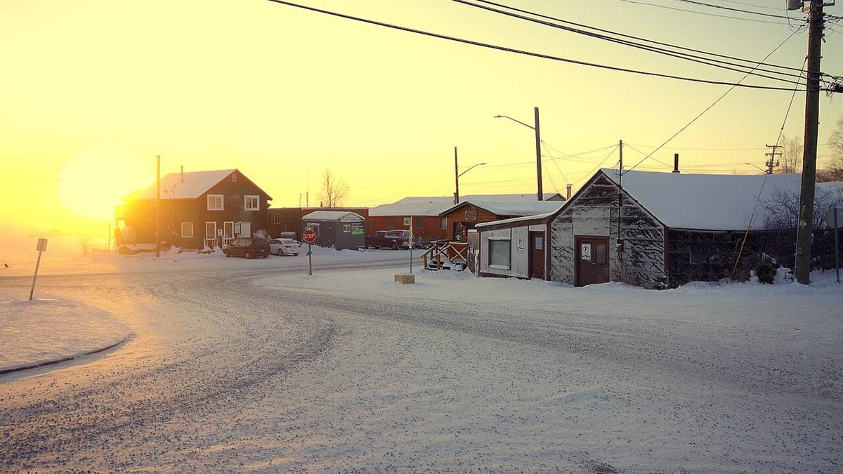 Snow-covered Old Town Yellowknife at sunrise