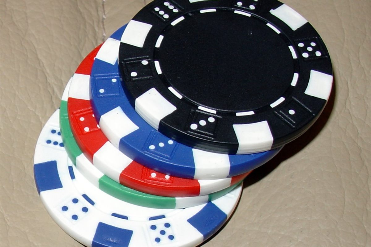 Close-up of poker chips with edge spots, the details used to spot fake casino chips Canada players handle