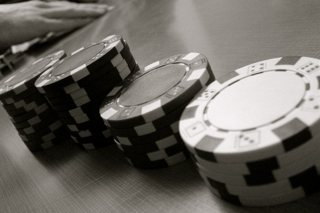 Black and white stacks of casino chips on a table