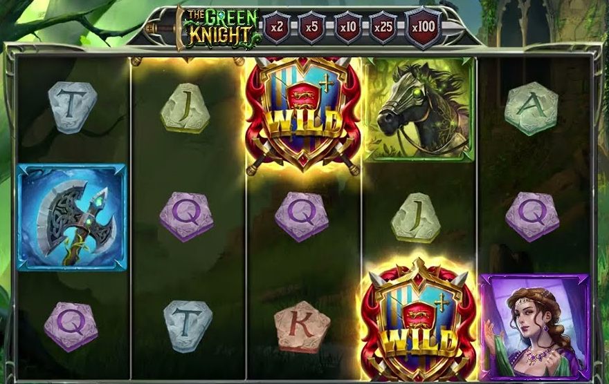 Two shield wilds on the Green Knight reels beside the horse, axe and lady symbols