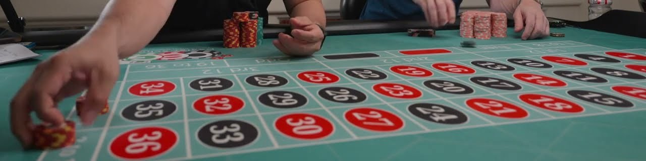 Chips placed on a roulette layout with the dozen boxes along the edge